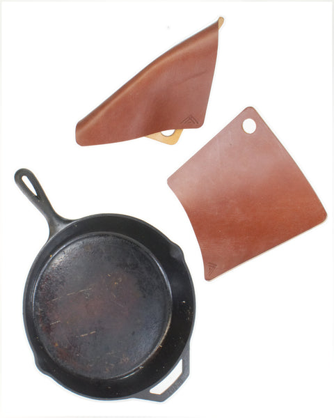 Square leather hot pads and cast iron pad